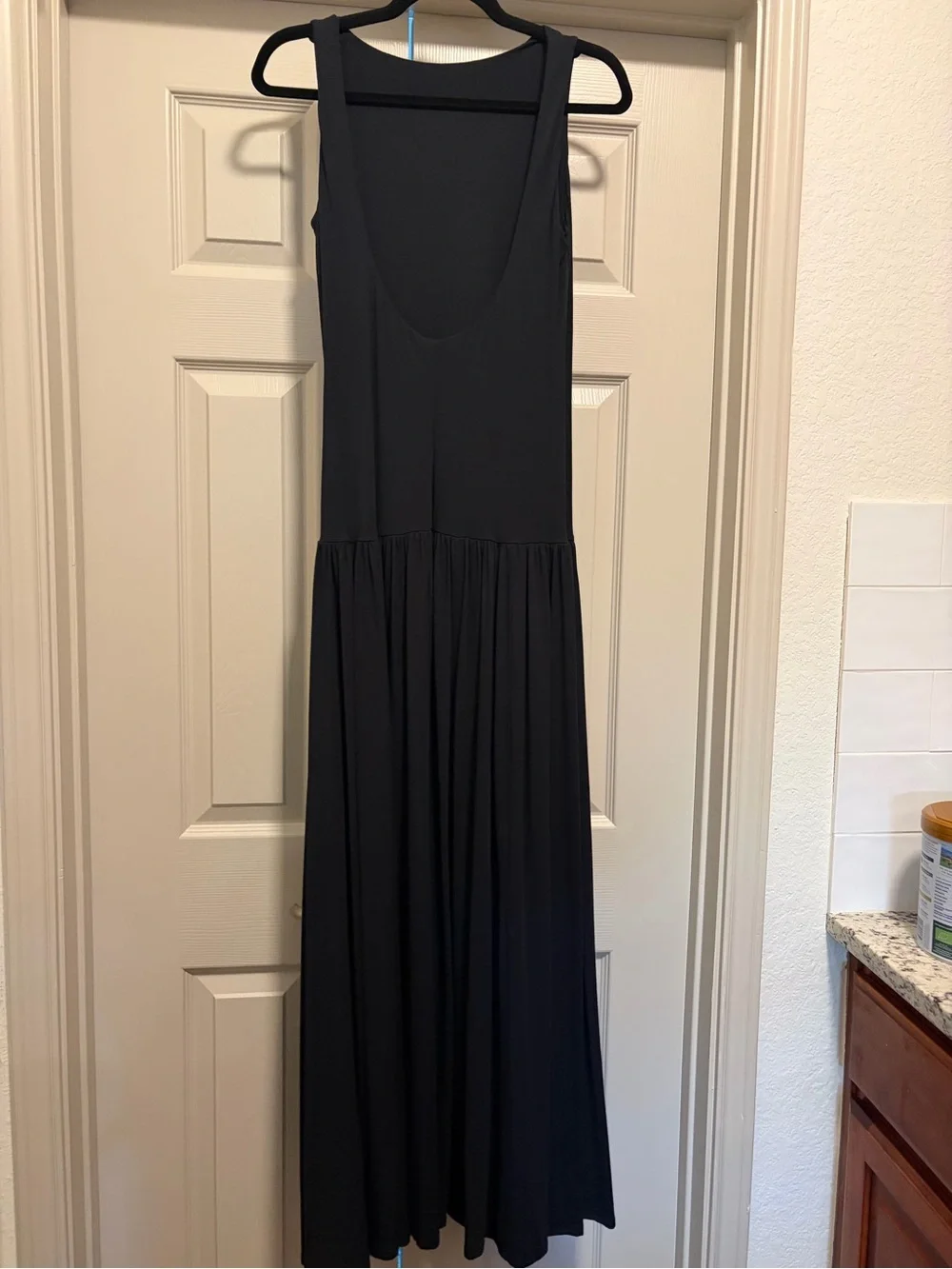 Sleeveless Low Black Maxi Dress with Pleated Skirt